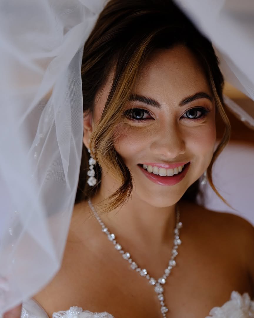 Bride with a soft smoky eye for an evening reception.