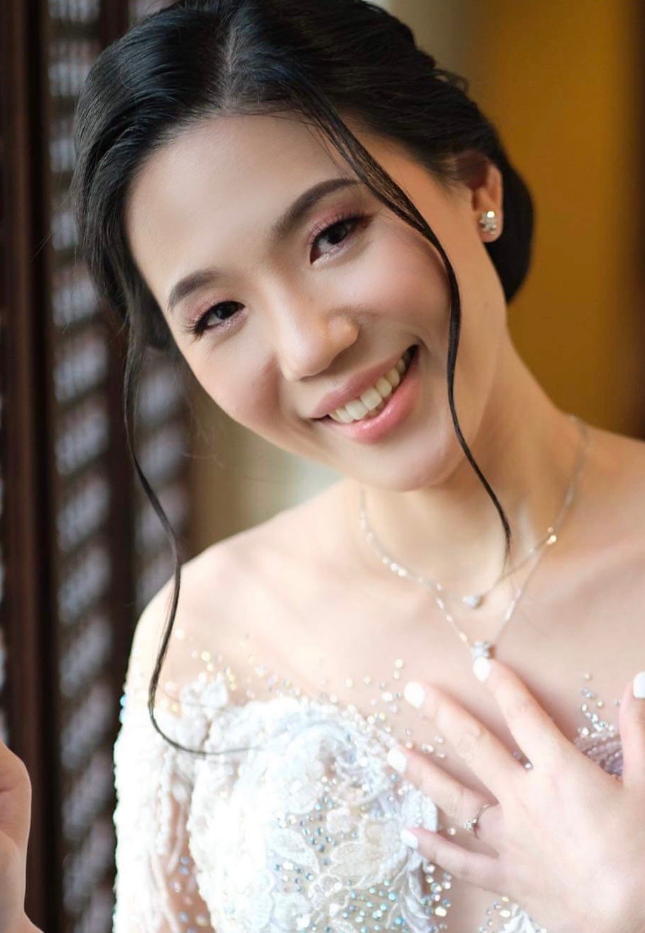 Bride with natural, luminous skin and a barely-there lip for a garden ceremony.